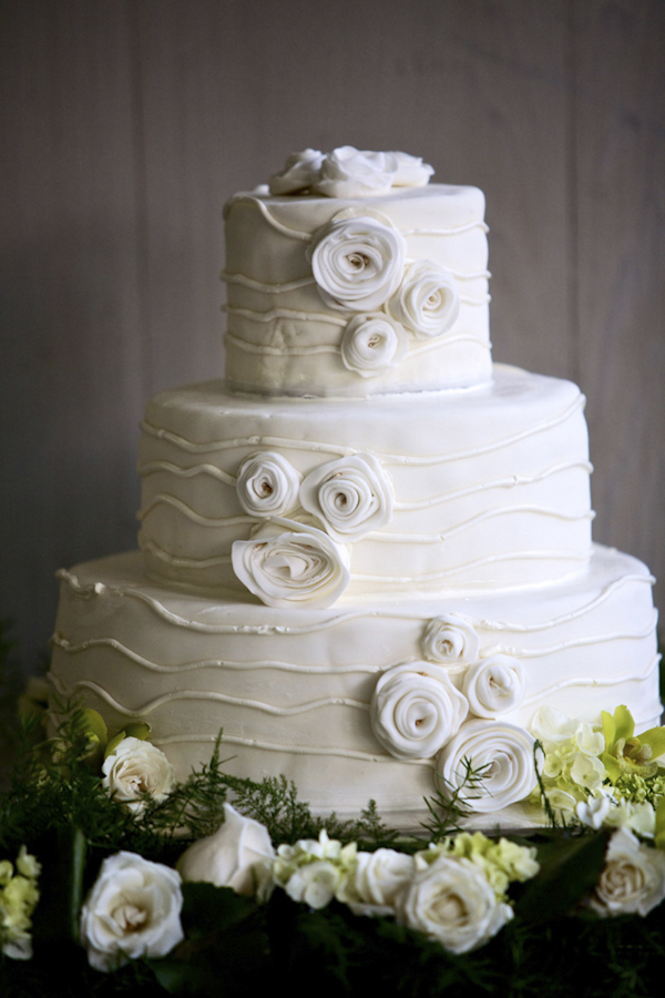 All-white wedding cake with rosebud icing decor - photo by top Atlanta-based wedding photographer Scott Hopkins Photography